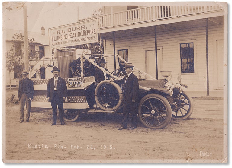 [3733181] 1915 Photograph of Eustis, Florida showing a local business car festooned for President’s Day. Porter Photo.